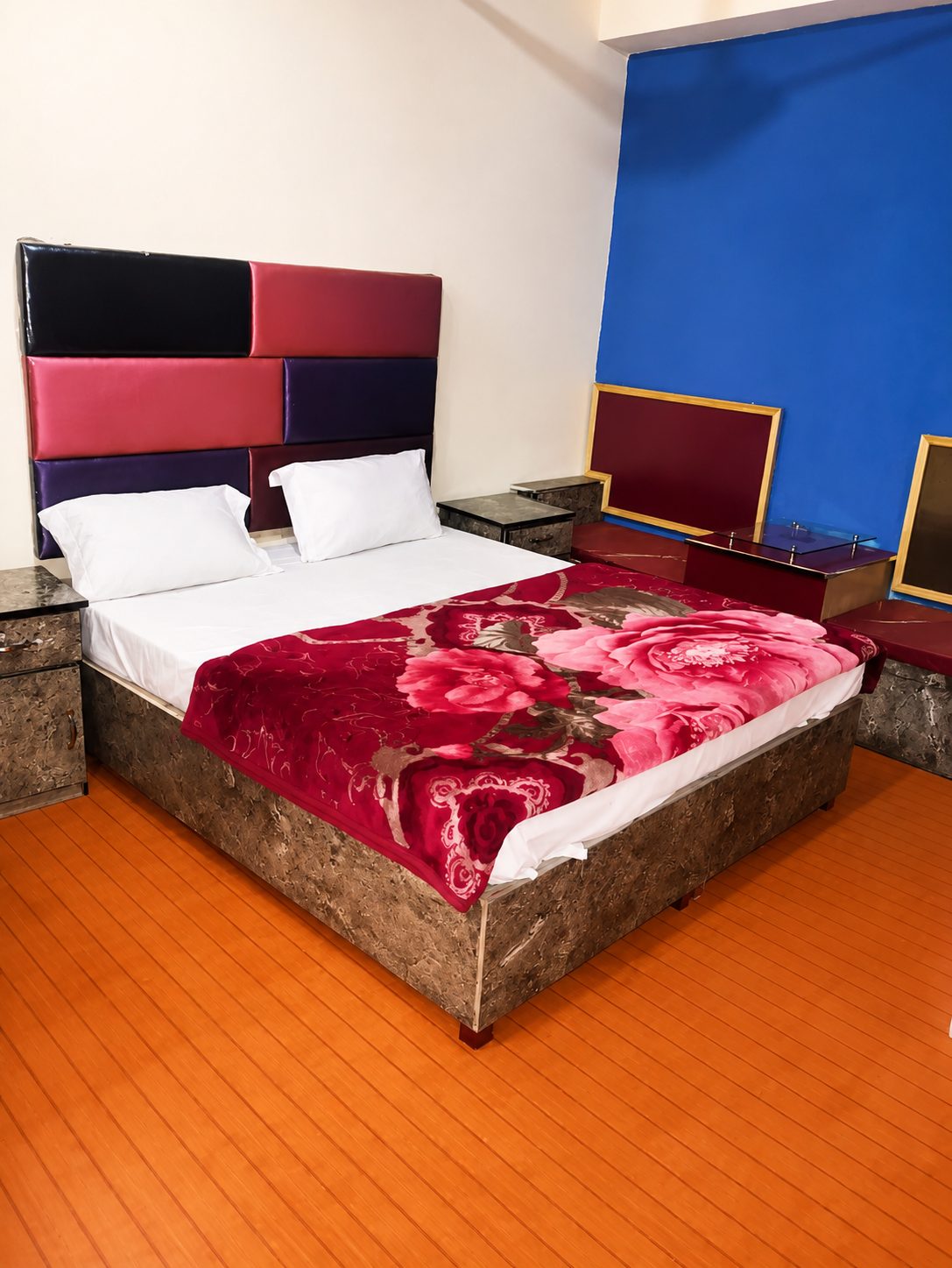 Premium master bedroom with air conditioning and bold headboard